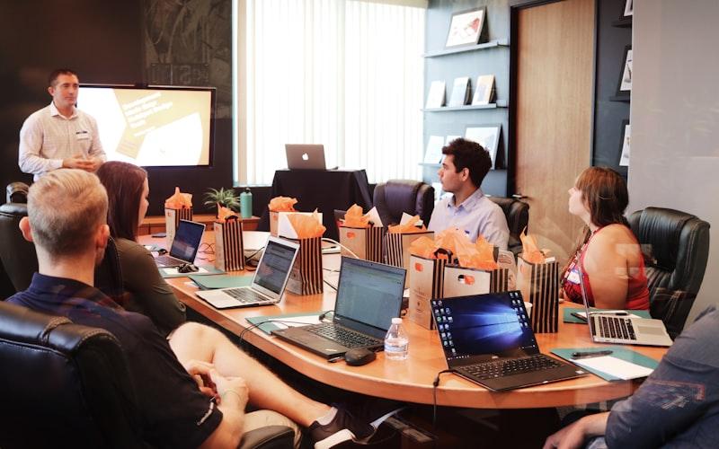 Leader presenting to a team in a boardroom