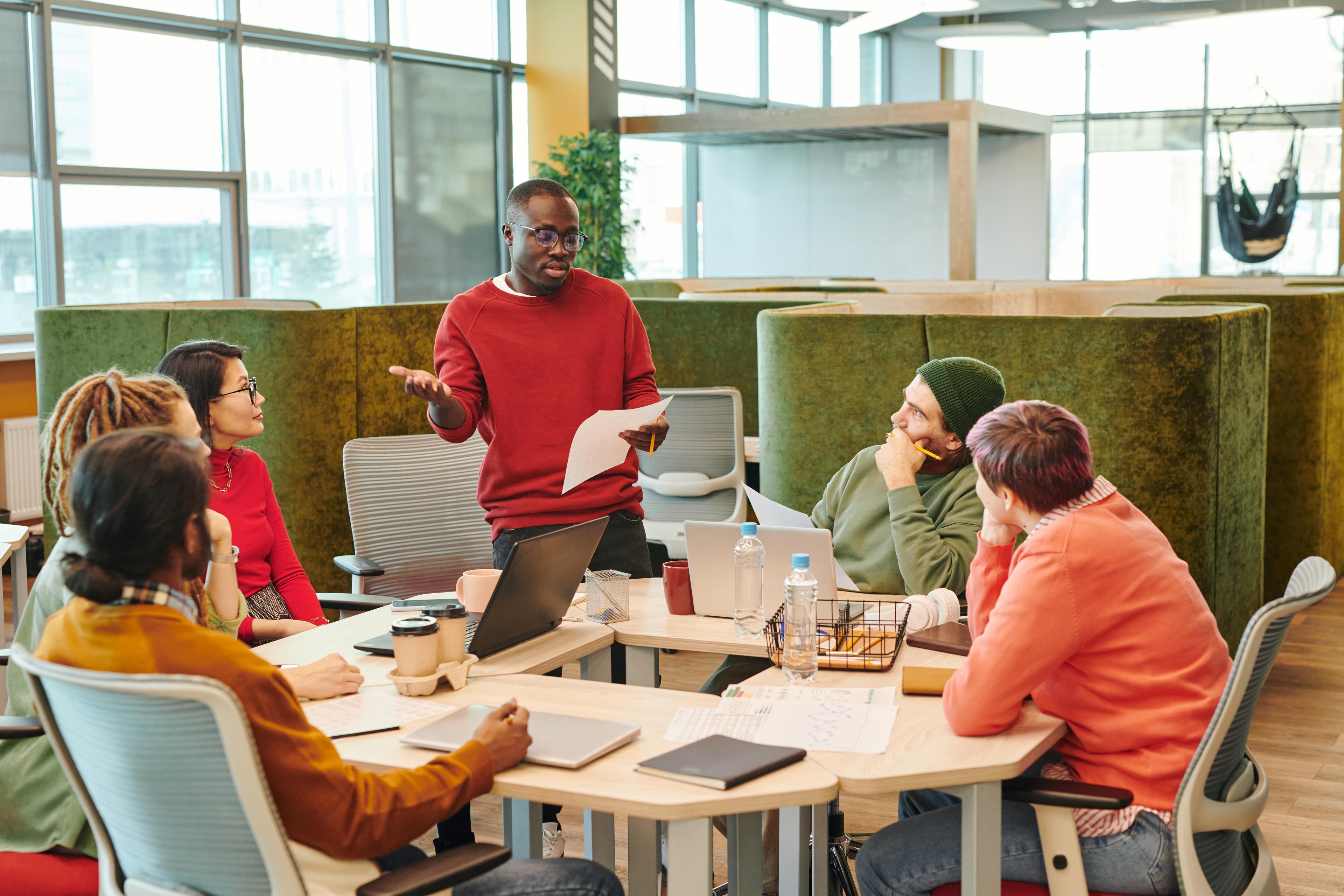 Diverse team collaborating in modern workspace